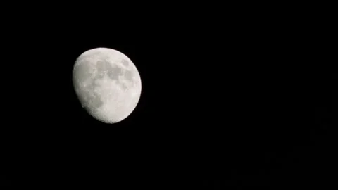 The moon rolls through the night sky, shooting at bmpcc. time lapse Stock Footage 134236704