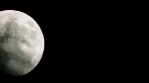 The moon rolls through the night sky, shooting at bmpcc. time lapse Stock Footage 134236871