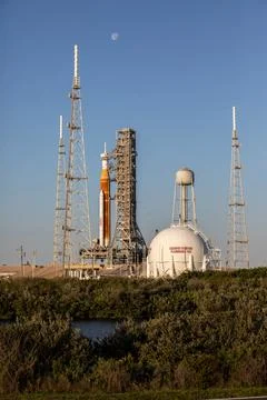 The Moon serves as a background for the Artemis I Space Launch System (SLS).. Fotos Stock