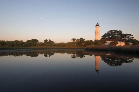 Moon set over the lighthouse at St. Marks National Wildlife Refuge, Florida Stock Photos