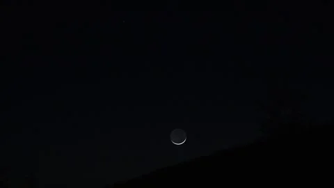 Moon set over mountains Video stock 317966351