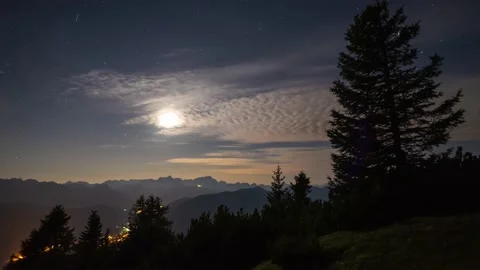 The Moon Sets on a Cloudy Sky Stock Footage 149910472