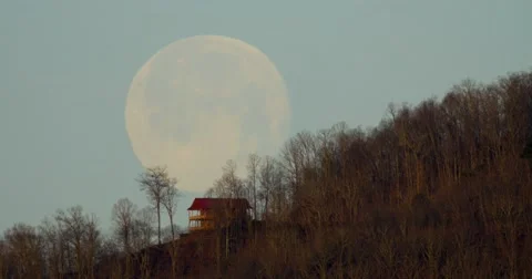 Moon setting behind mountain cabin 04-05-2015 Stock Footage 48853958