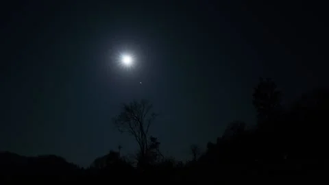Moon Setting in the Night Sky Timelapse Stock Footage 326702111