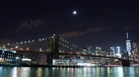 The Moon Setting over the Brooklyn Bridge and the Manhattan Skyline Video stock 62566817