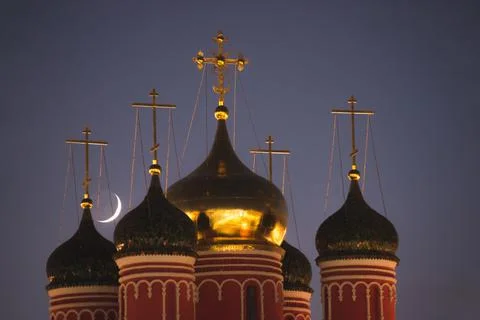 Moon setting over the domes of the Orthodox Church in Moscow Stock Photos