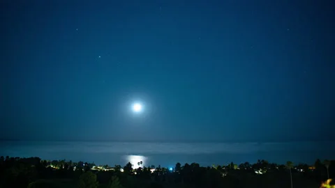Moon Setting over Ocean Timelapse 스톡 동영상 222795902