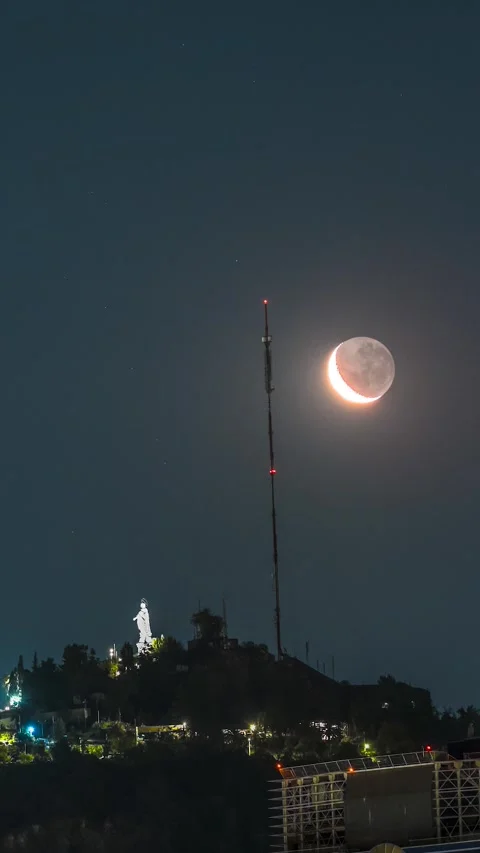 Moon Setting over San Cristobal Hill and Virgin Mary Statue in Santiago Chile Stock Footage 334217401