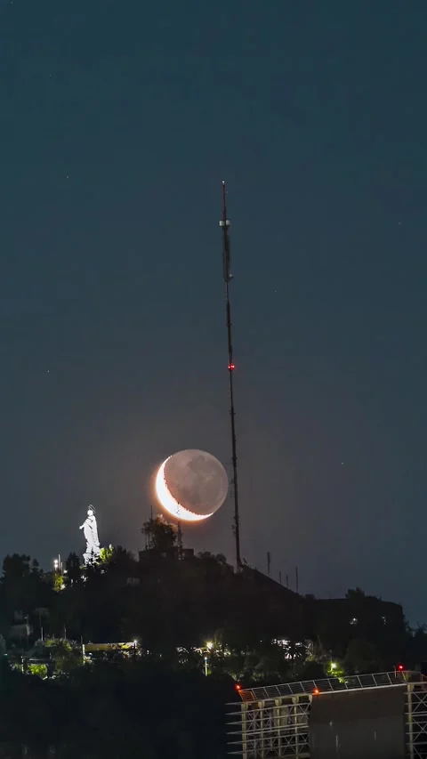 Moon Setting over San Cristobal Hill and Virgin Mary Statue in Santiago Chile Stock Footage 334217406