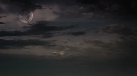 Moon setting through clouds HD Stock Footage 33834724
