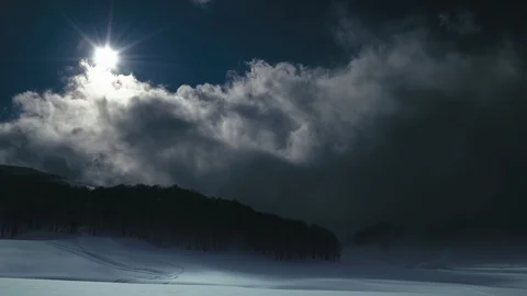 Moon shine, slow clouds and snow covered field. Winter night landscape Stock-Footage 87994681