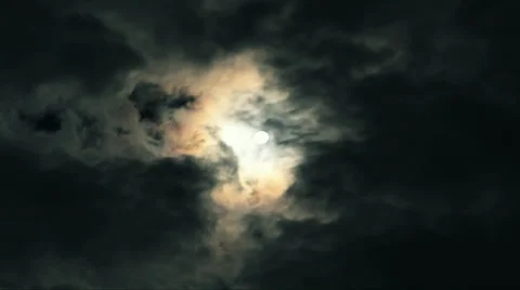 Moon shrouded by moving clouds - dark Timelapse Stock Footage 31586411