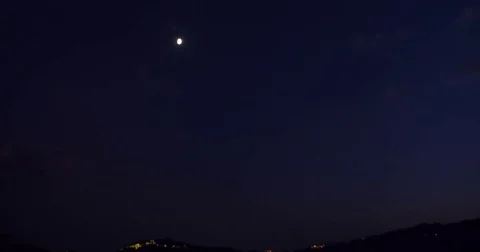 Moon in the sky with passing clouds - time lapse 4K DCI Stock Footage 79663748