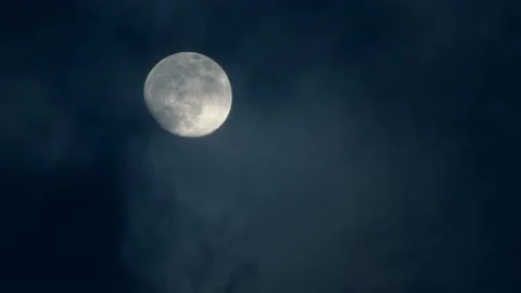 Moon slowly obscured by clouds at night Stock Footage 146233131