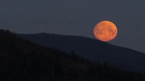 Moon at sunrise in the mountains. Stock Footage 75751727
