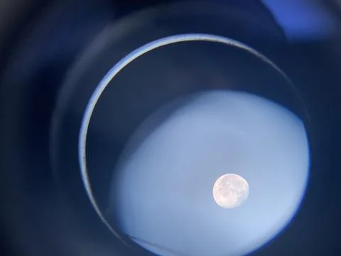 Moon surface visible through telescope lens Stock Photos