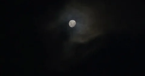 Moon with thin clouds passing over Video stock 73490133