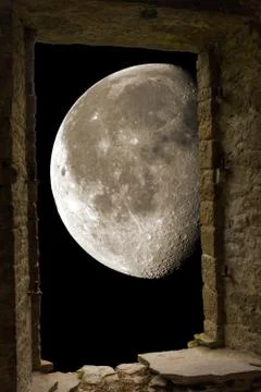 Moon through ancient stone window Stock Photos