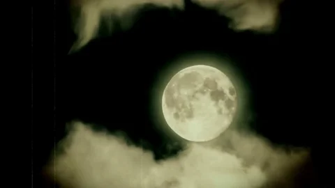 Moon through the clouds in old fashioned film style. Stock Footage 75187683
