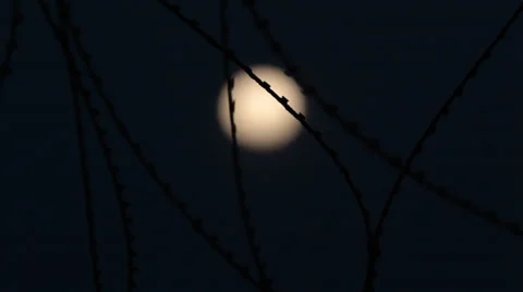Moon Through Razor Wire 스톡 동영상 35576683