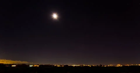 Moon Time Lapse over Desert City Stock Footage 57755190