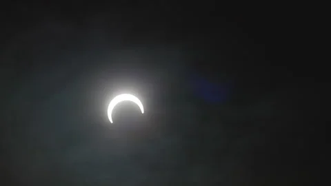 Moon Timelapse In The Sky With Clouds During Annular Solar Eclipse. Stock Footage 257659915