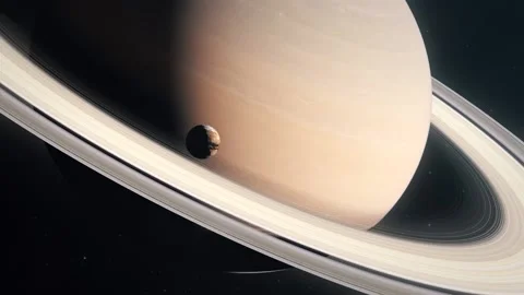 The Moon Titan Orbiting the Gas Giant Planet of Saturn Stock Footage