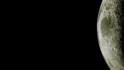 Moon visible in clear night sky with dark background Stock Footage 345054577