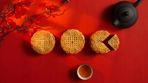 Mooncakes and tea set on red background for Mid Autumn Festival Stock Photos