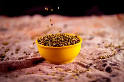 Moong dal is falling on the moong bean,green mung beans flso know as mung dal Stock Photos