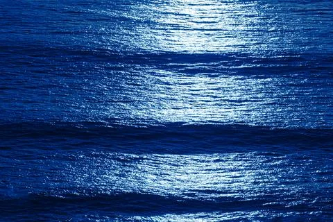 Moonlight and ocean waves Stock Photos