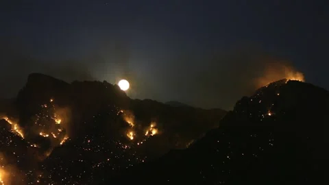 Moonlight on Clear Sky Above Burning Hills. Massive Wildfires at Night, Stock Footage 147365191