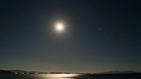 Moonlight path with fool moon above calm sea surface Stock Footage 115704904