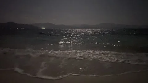 Moonlight Reflection on Ocean Waves at Night Stock Footage 340899551