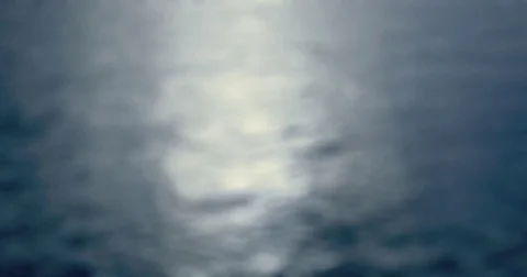 Moonlight - Seamless loop of a completely defocused shot of a wavy water surface Stock-Footage 78647948