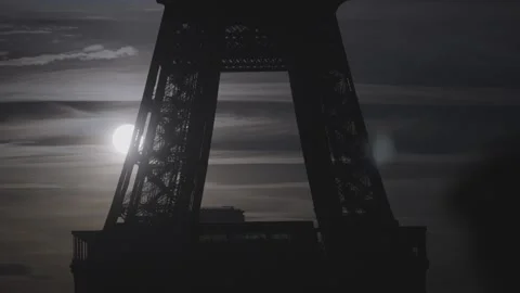 Moonlight Through Eiffel Tower Structure Stock Footage 340546759