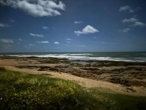 Moonlit beach at night Stock Photos