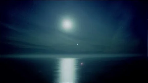 Moonlit Ocean Night with Starry Sky and Clouds Video stock 327268306