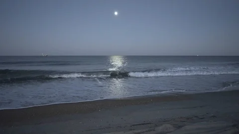 Moonlit water with distant boat Video stock 101038560
