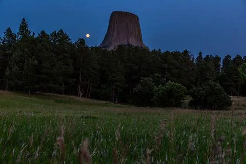 Moonrise From the Grass Field on Devils Tower in the Distance, Devils Tower Stock Photos