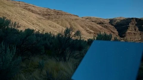 Moonrise light shadows move over rotating mirror blue moonlit sky time lapse Stock Footage 81799014