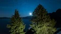 Moonrise moonlight and stars reflected on Crater Lake National Park 4k or 4k+ Resolution