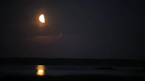 Moonrise over a lake Stock Footage 49696851