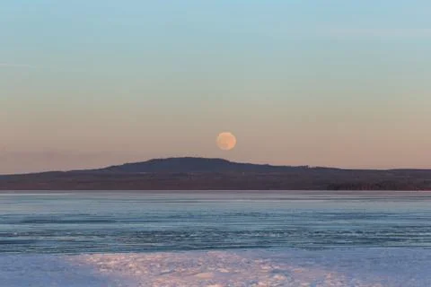 Moonrise over mountain Kinnekulle in sweden Stock Photos