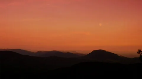 MoonriseSunset PanWarm 0005JB Stock Footage 565075