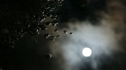 Moon's reflection in the puddle Stock Footage 32864594
