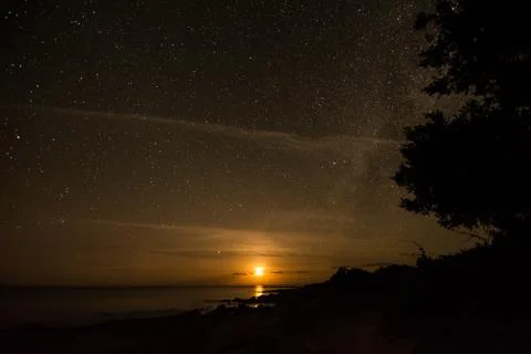 Moonset in the Beach Stock-Fotos