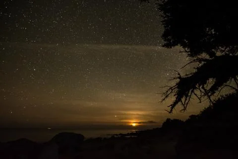 Moonset in the Beach Stock-Fotos