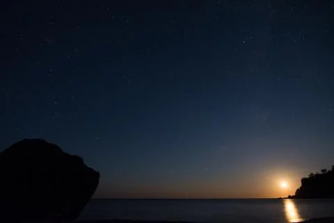Moonset in the Beach Stock-Fotos