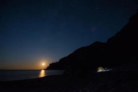 Moonset in the Beach Stock-Fotos